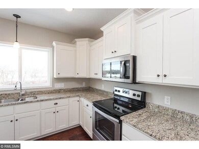 Granite countertops and stainless appliances.