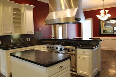 For the serious chef, this kitchen has 3 ovens, lo