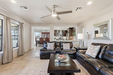 Living area featuring recessed lighting and a cei