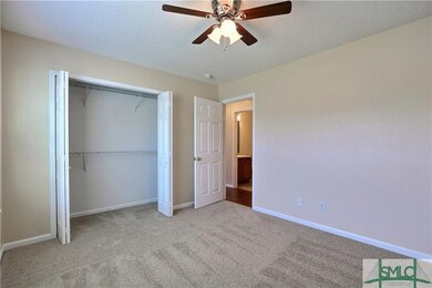 First bedroom with new carpet/pad, window treatmen