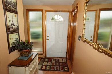 Welcoming foyer with large coat closet.