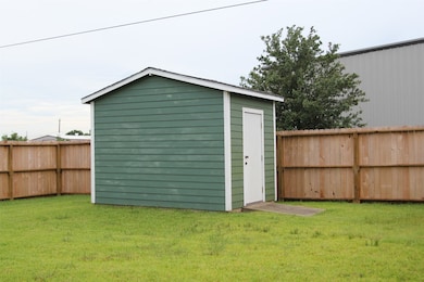 Oversized shed for extra storage.