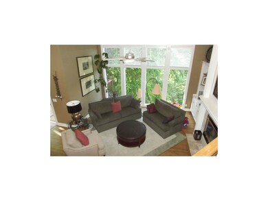 Large hearth area with floor to ceiling windows th