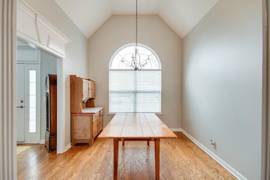 Bright formal dining room with tall ceiling and custom trim details!