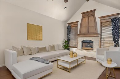 Living room featuring lofted ceiling, ceiling fan,