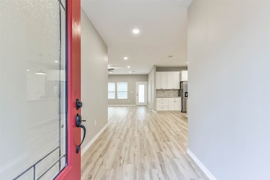 Step through the striking red front door into a space filled with warmth, charm, and a perfect blend of comfort and style.