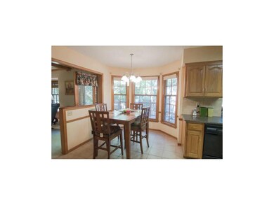 EAT IN KITCHEN OVERLOOKING DECK AND BACKYARD.