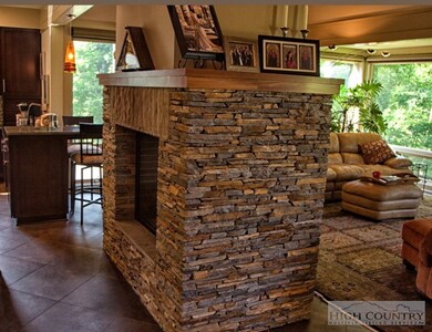See through gas fireplace centers the space.