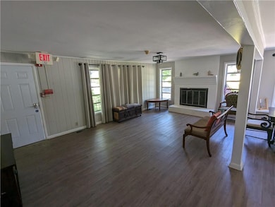 Living room with dark hardwood / wood-style floori