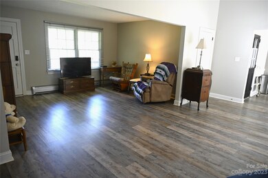 Open concept living with an oversized, front to back living room with fireplace