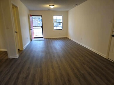 Interior space with dark hardwood / wood-style flo