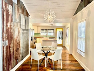 Dining room featuring a chandelier, wooden ceilin