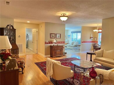 Opens to kitchen and Carolina room