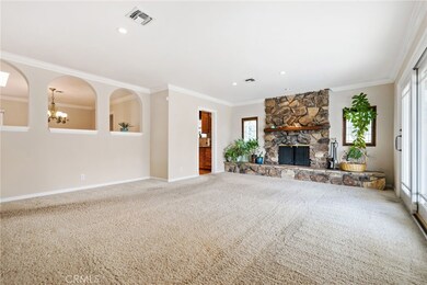 There is plenty of space in this oversized living room.  Enjoy your handsome stone fireplace on those chilly winter nights.