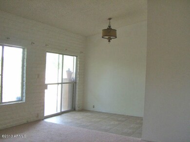 Living room, to dining & out to patio