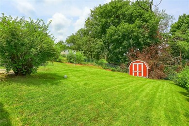 Shed at the back of the large yard.
