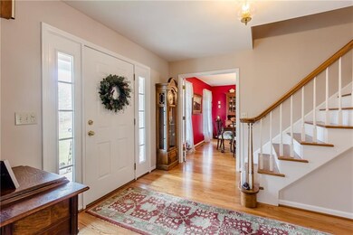 Gracious foyer with hardwood floors