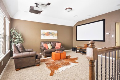 Family-sized gameroom for your entertaining pleasure!  Currently being used as a media room-screen, projector, subwoofer, and receiver sold with the home!  This room would also make a perfect playroom for young kids, add a pool table for teens, turn into a workout room, or even another bedroom-full bath upstairs with it!