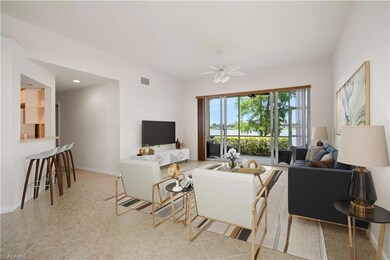 Living room featuring baseboards, light tile patte