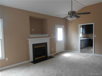 Family Room/Den has vaulted ceiling, new carpet, f