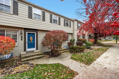 Doorway to property featuring brick  and front porch