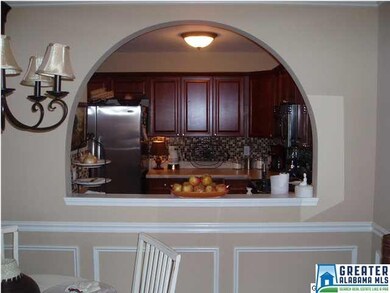 The archway between the living area and kitchen ke