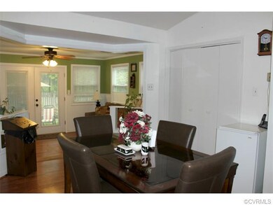 The dining area steps down to the sunroom.....