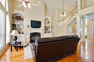 View of den, entrance and staircase.