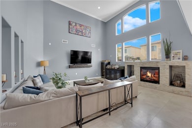 Living area with a glass covered fireplace, crown