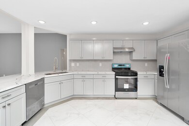 Kitchen with quartz countertops and new appliances