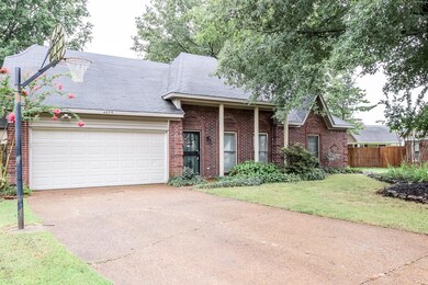 View of front facade with a garage and a front yar