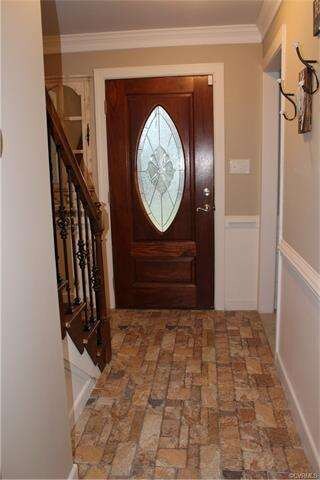 Tiled foyer, chair rail, crown molding