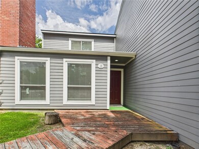 Property entrance with a wooden deck