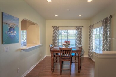 Separate dining area with recessed lighting, kitch