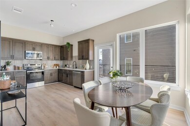 Kitchen with stainless steel appliances, a sink, 