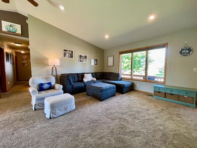 The living room is immediately adjacent from the main entrance and looks out on the front porch with a street view from the large windows.