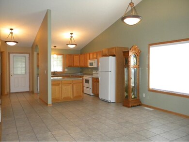Open floor planCeramic tile in foyer, hall, kitche