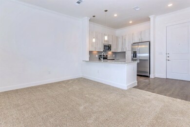Kitchen with breakfast bar overlooking dining room