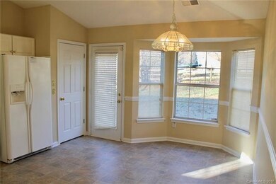 Kitchen offers open concept to great room, new flo