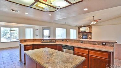 Lovely chef's kitchen with center island, opens to