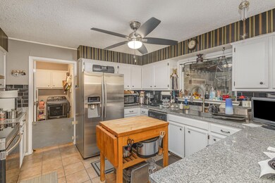 Kitchen featuring appliances with stainless steel 