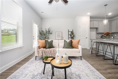 Living room featuring light wood-type flooring, recessed lighting, and a ceiling fan