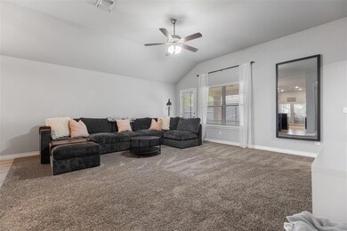 Living room featuring visible vents, baseboards, a