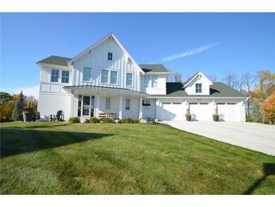 Enjoy relaxing on your picturesque front porch or 