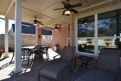 A large covered back patio for enjoying coffee in the morning or watching the sunset in the evening!