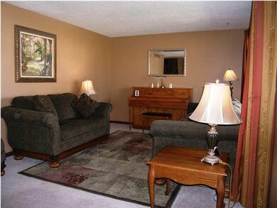 Spacious living room features pleasing neutral dec