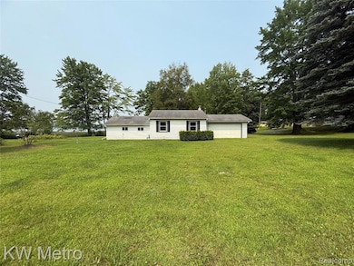 Hallway featuring light wood-style floors and baseboards
