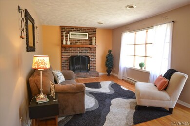 FAMILY ROOM IS LIGHT, BRIGHT WITH HARDWOODS AND MA