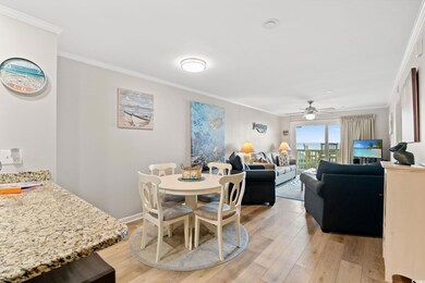 Dining room with light wood finished floors, ornam
