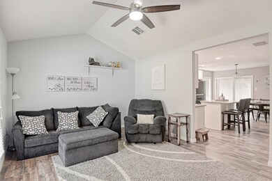 Light & bright living area greets you as you walk through the front door.